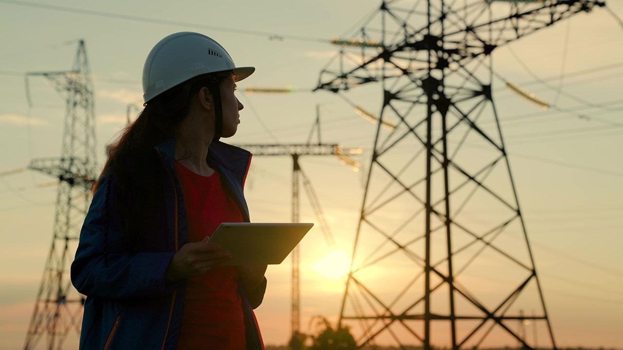 An engineer conducts an assessment at a substation to improve utility operations